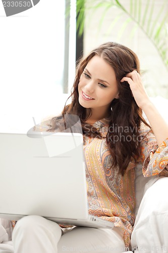 Image of happy woman with laptop computer