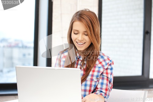 Image of happy woman with laptop computer