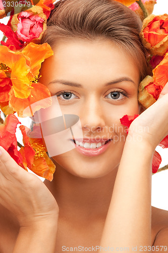 Image of lovely woman with red flowers