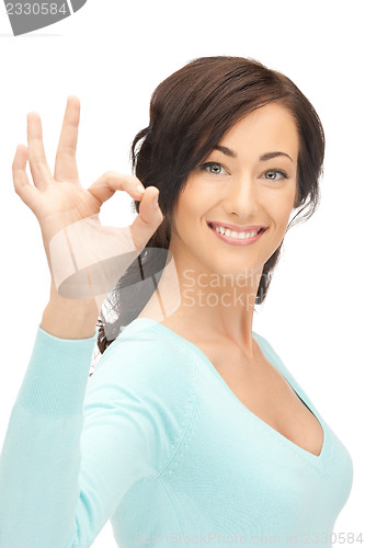 Image of lovely teenage girl showing ok sign