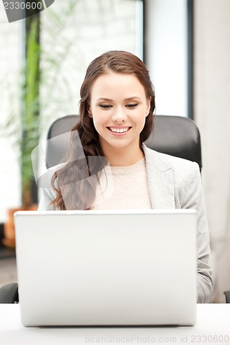 Image of happy woman with laptop computer