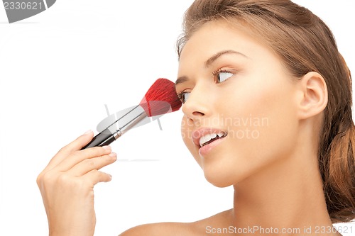 Image of beautiful woman with brush