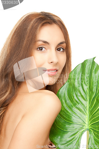 Image of woman with green leaf