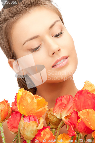Image of lovely woman with red flowers