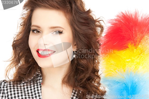 Image of beautiful woman with cleaning sweep