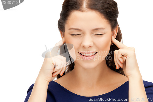 Image of woman with fingers in ears