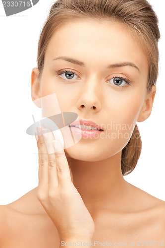Image of beautiful woman with cotton pad