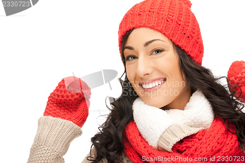 Image of beautiful woman in hat, muffler and mittens