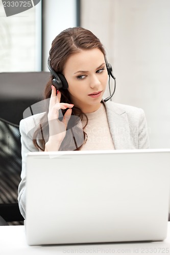 Image of helpline operator with laptop computer