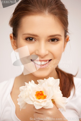 Image of beautiful woman with white flower