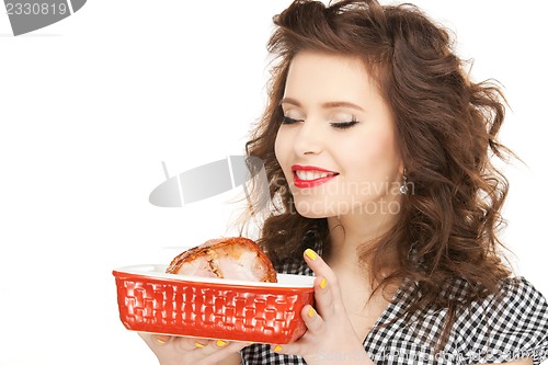 Image of lovely housewife with meat