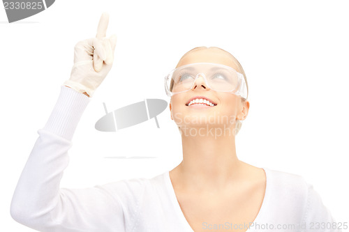 Image of woman in protective glasses and gloves