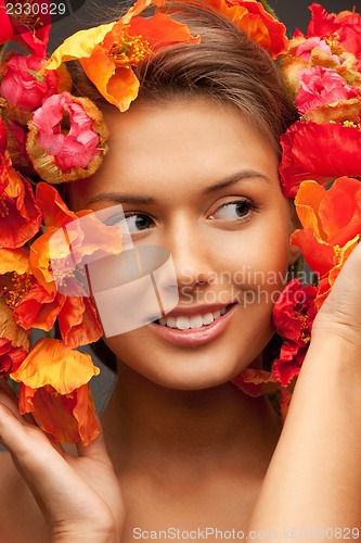 Image of lovely woman with red flowers