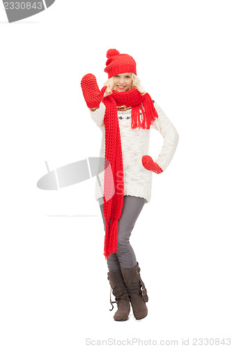 Image of beautiful woman in hat, muffler and mittens