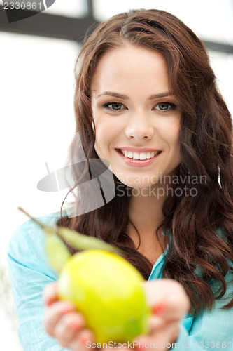 Image of lovely woman with lemon