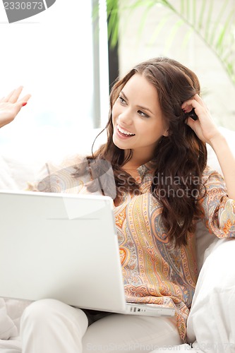 Image of happy woman with laptop computer