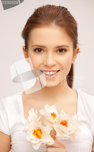 Image of beautiful woman with white flower