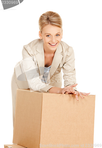 Image of attractive businesswoman with big boxes