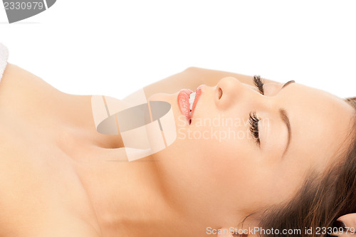 Image of beautiful woman in massage salon