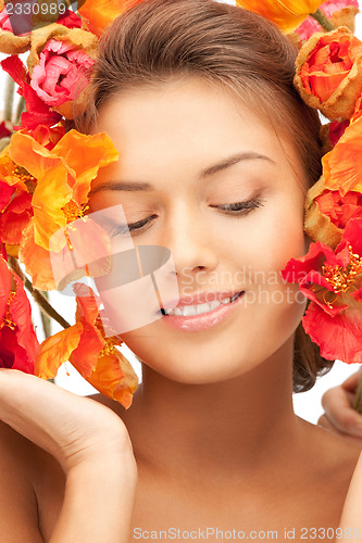 Image of lovely woman with red flowers