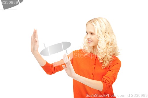 Image of businesswoman working with something imaginary