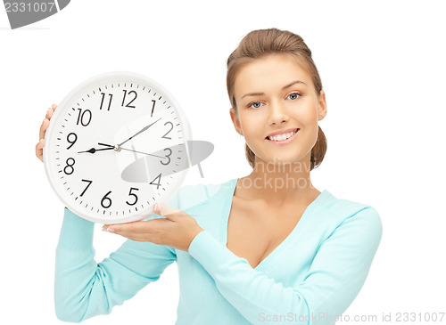 Image of woman holding big clock