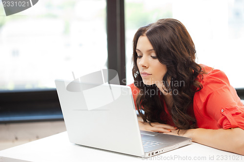 Image of happy woman with laptop computer