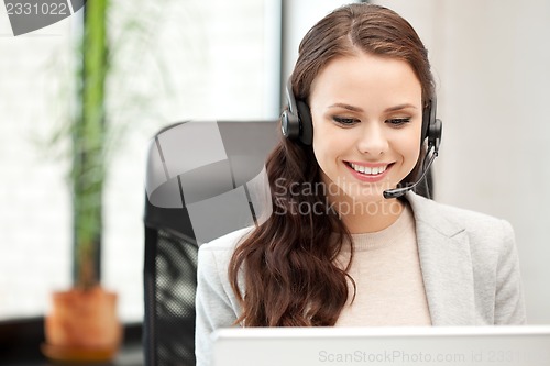 Image of helpline operator with laptop computer