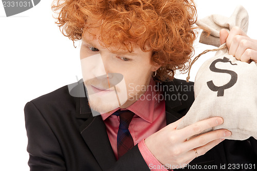 Image of man with dollar signed bag