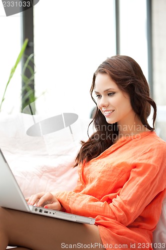 Image of happy woman with laptop computer