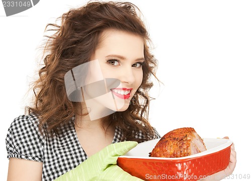 Image of lovely housewife with meat