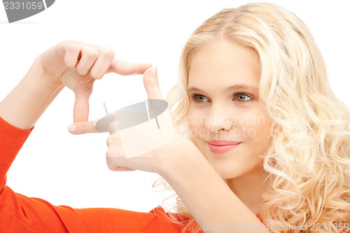 Image of lovely woman creating a frame with fingers