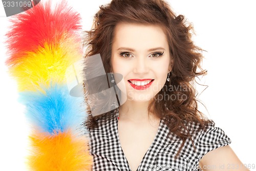 Image of beautiful woman with cleaning sweep