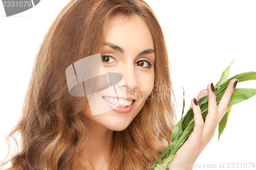 Image of woman with green sprout
