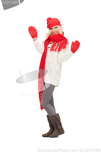 Image of beautiful woman in hat, muffler and mittens