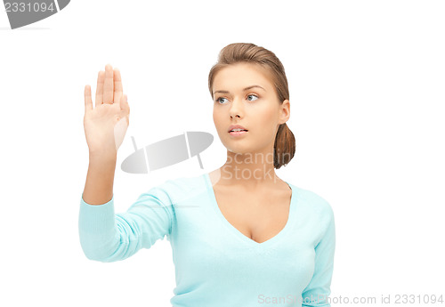 Image of businesswoman working with something imaginary
