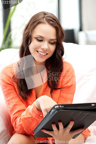 Image of happy woman with tablet pc computer