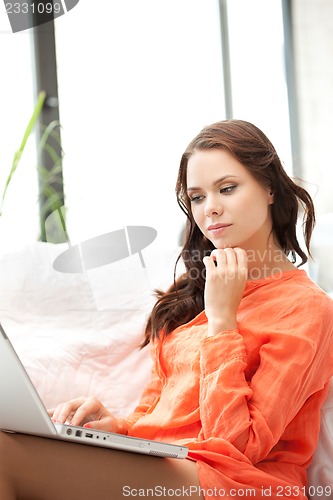 Image of happy woman with laptop computer
