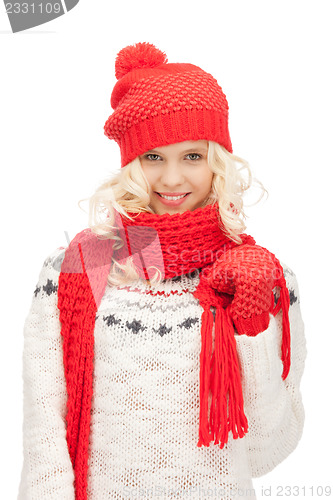 Image of beautiful woman in hat, muffler and mittens