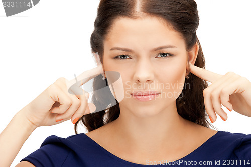 Image of woman with fingers in ears