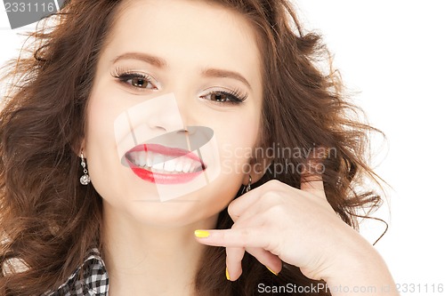 Image of woman making a call me gesture
