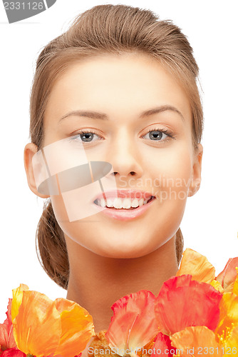 Image of lovely woman with red flowers