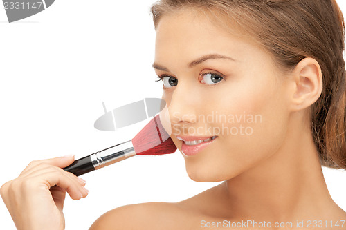 Image of beautiful woman with brush