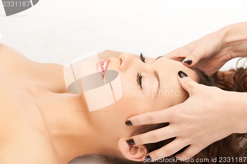 Image of beautiful woman in massage salon