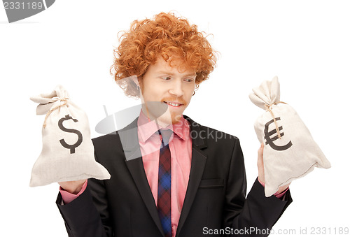 Image of man with euro and dollar bags
