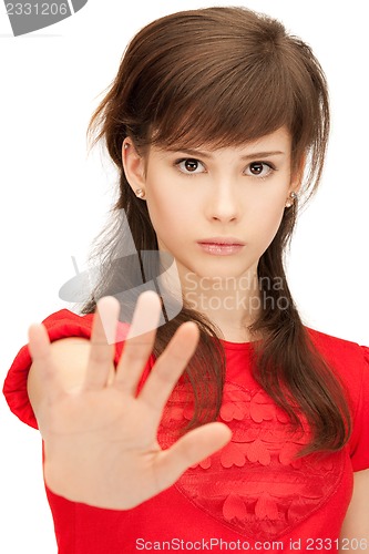 Image of teenage girl making stop gesture