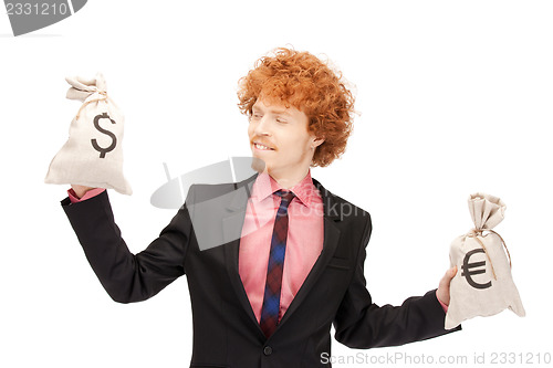 Image of man with euro and dollar bags