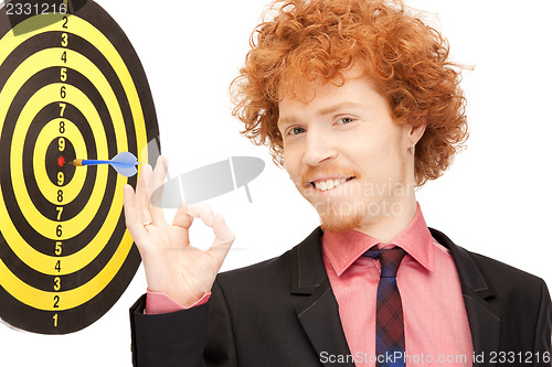 Image of businessman with dart and target