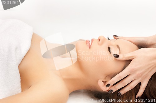 Image of beautiful woman in massage salon