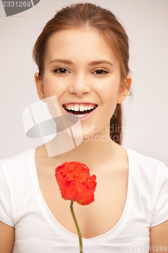 Image of beautiful woman with red flower